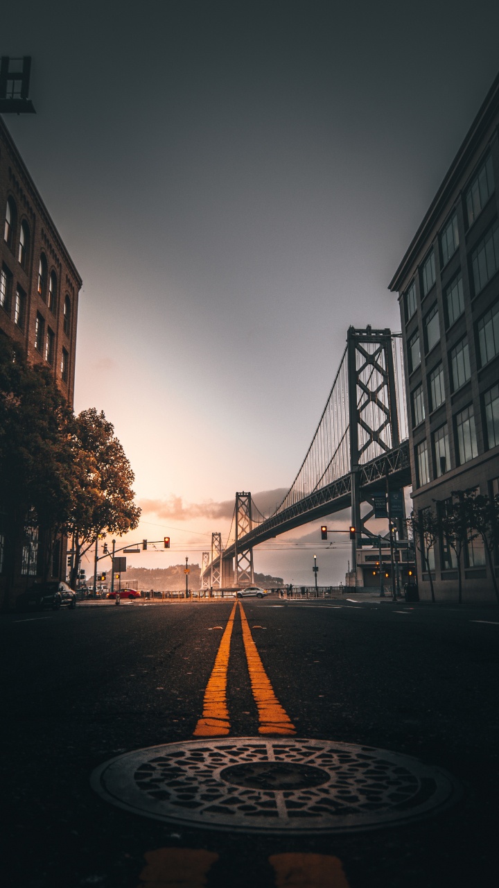 Bridge Over The River During Sunset. Wallpaper in 720x1280 Resolution