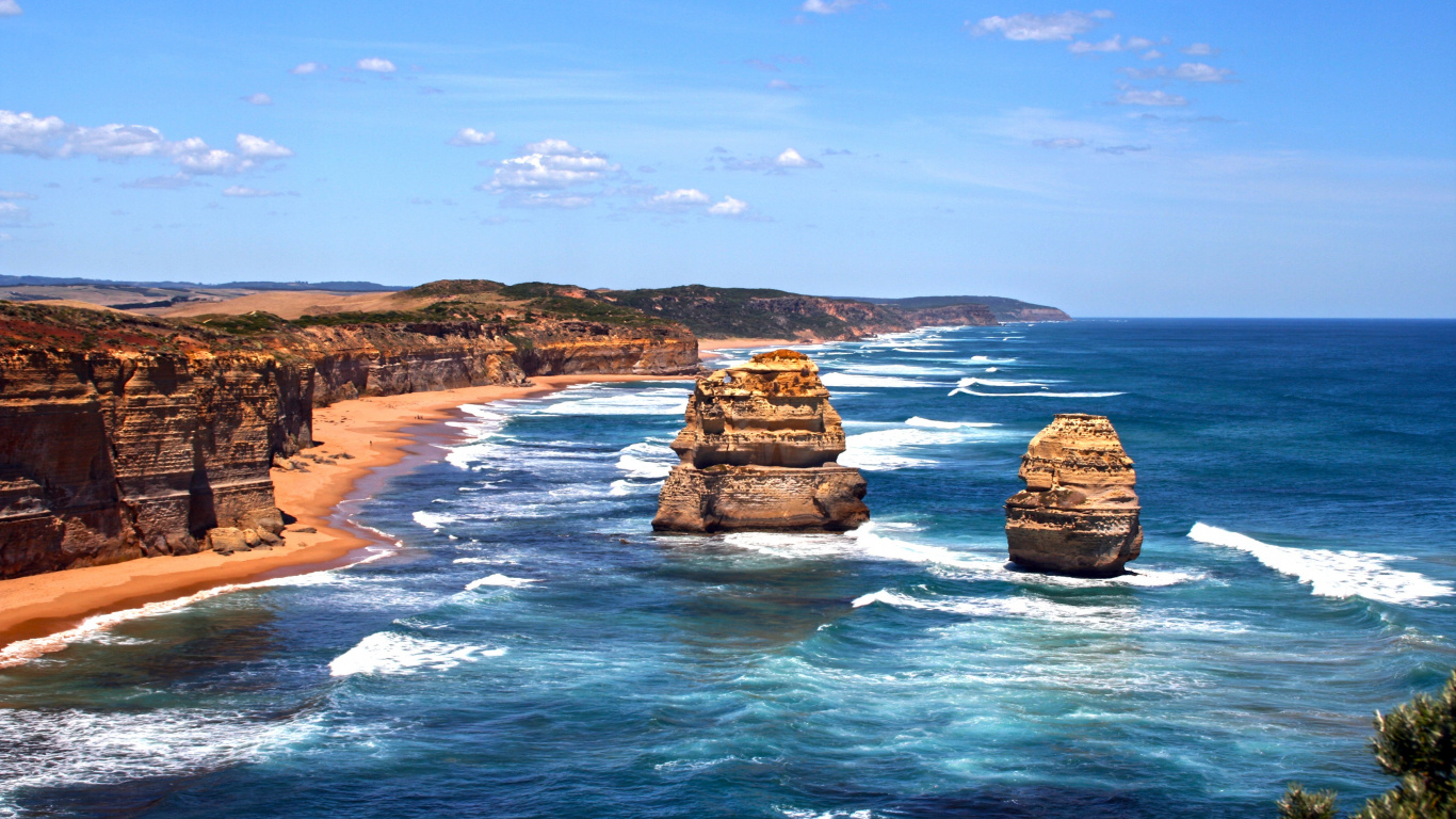 Brown Rock Formation on Sea Under Blue Sky During Daytime. Wallpaper in 1366x768 Resolution