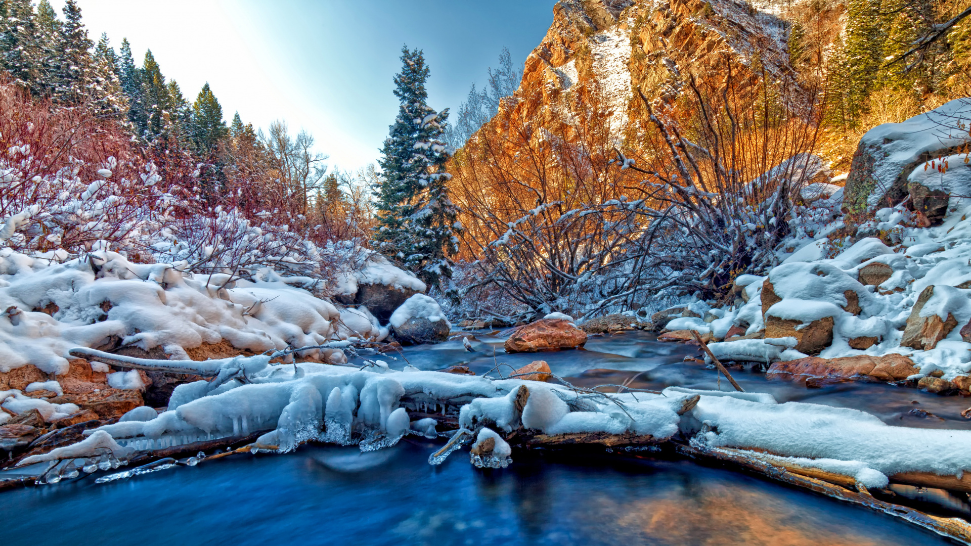 Snow Covered Trees and Rocks Beside River During Daytime. Wallpaper in 1920x1080 Resolution