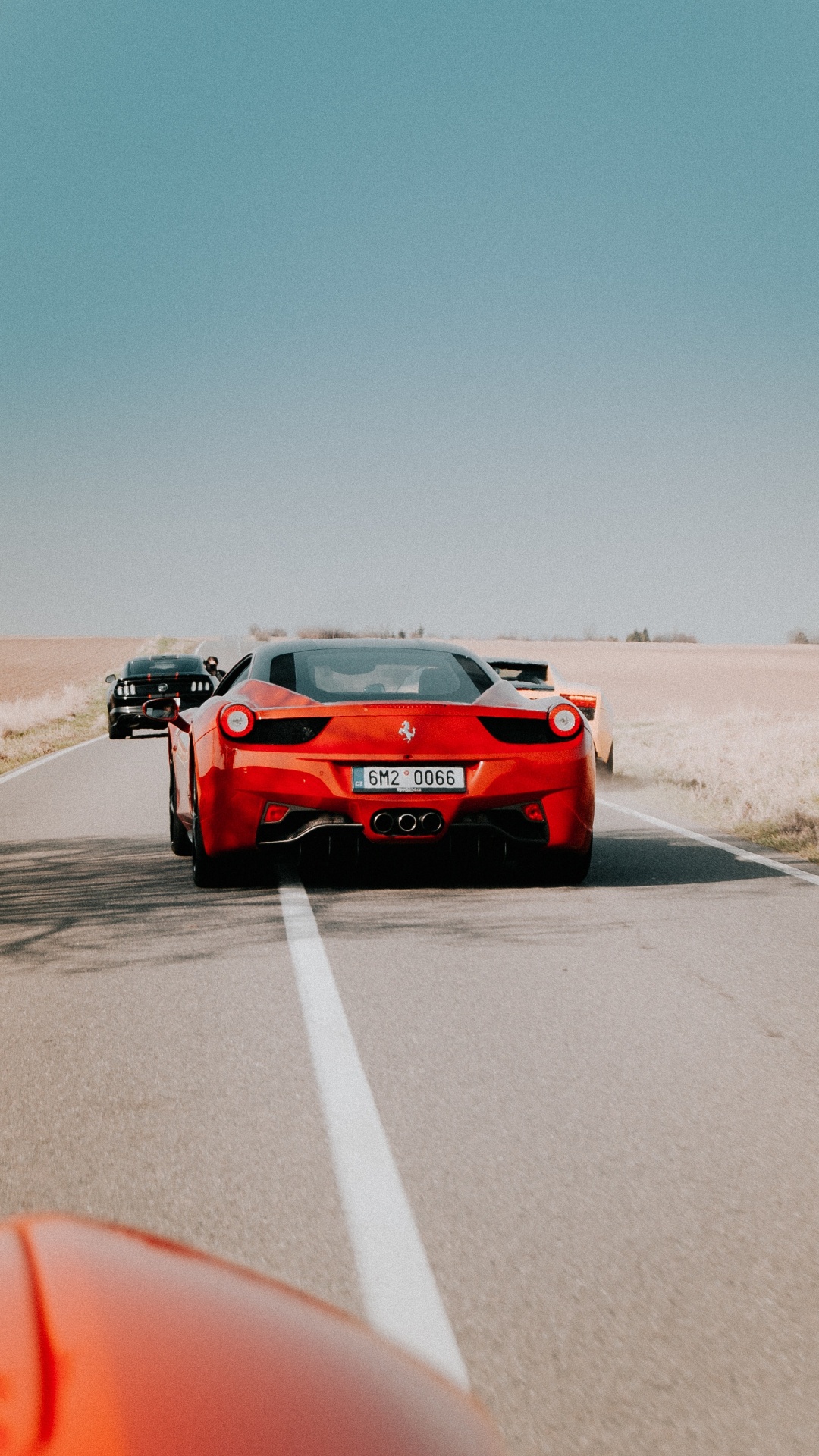 Red Porsche 911 on Gray Asphalt Road During Daytime. Wallpaper in 1080x1920 Resolution