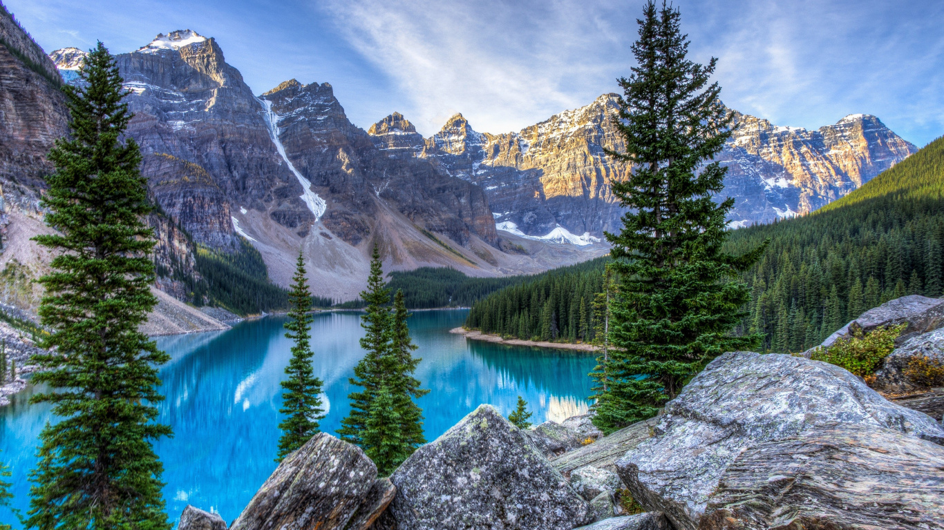 Green Pine Trees Near Lake and Mountain Under Blue Sky During Daytime. Wallpaper in 1366x768 Resolution