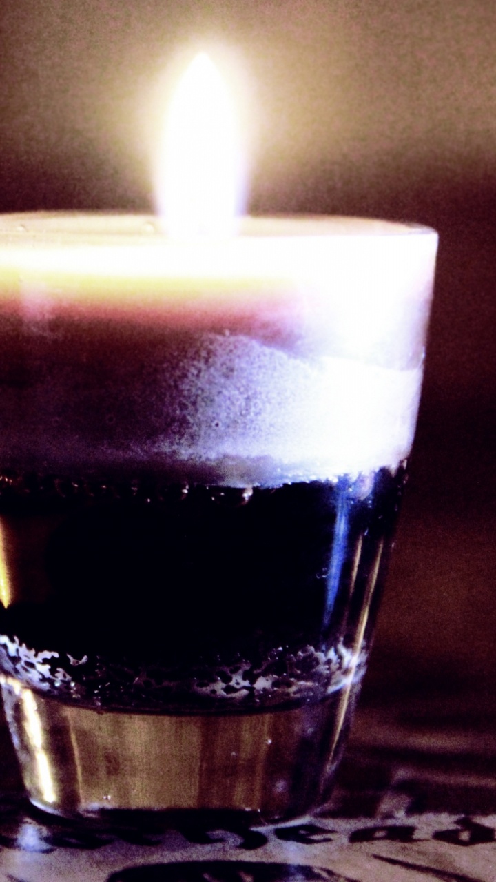 Lighted Candle in Clear Glass. Wallpaper in 720x1280 Resolution