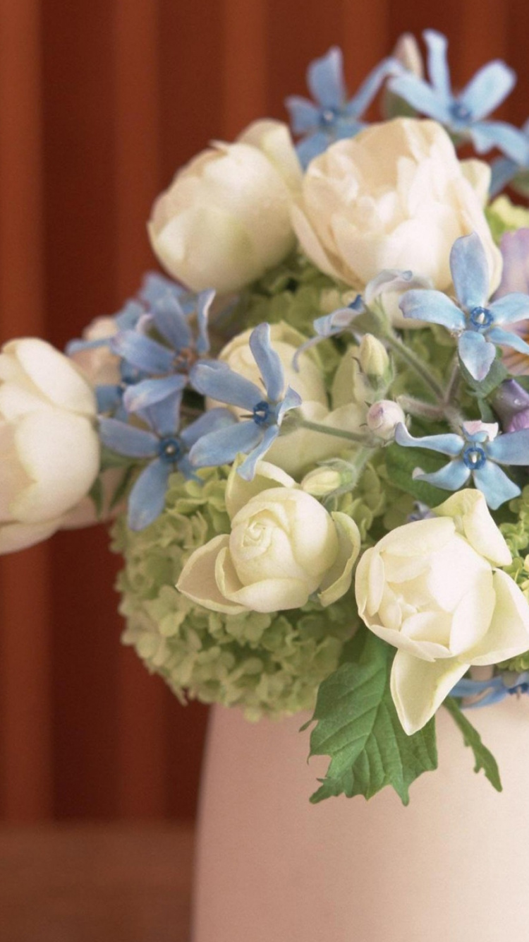 White and Purple Flowers in White Ceramic Vase. Wallpaper in 750x1334 Resolution