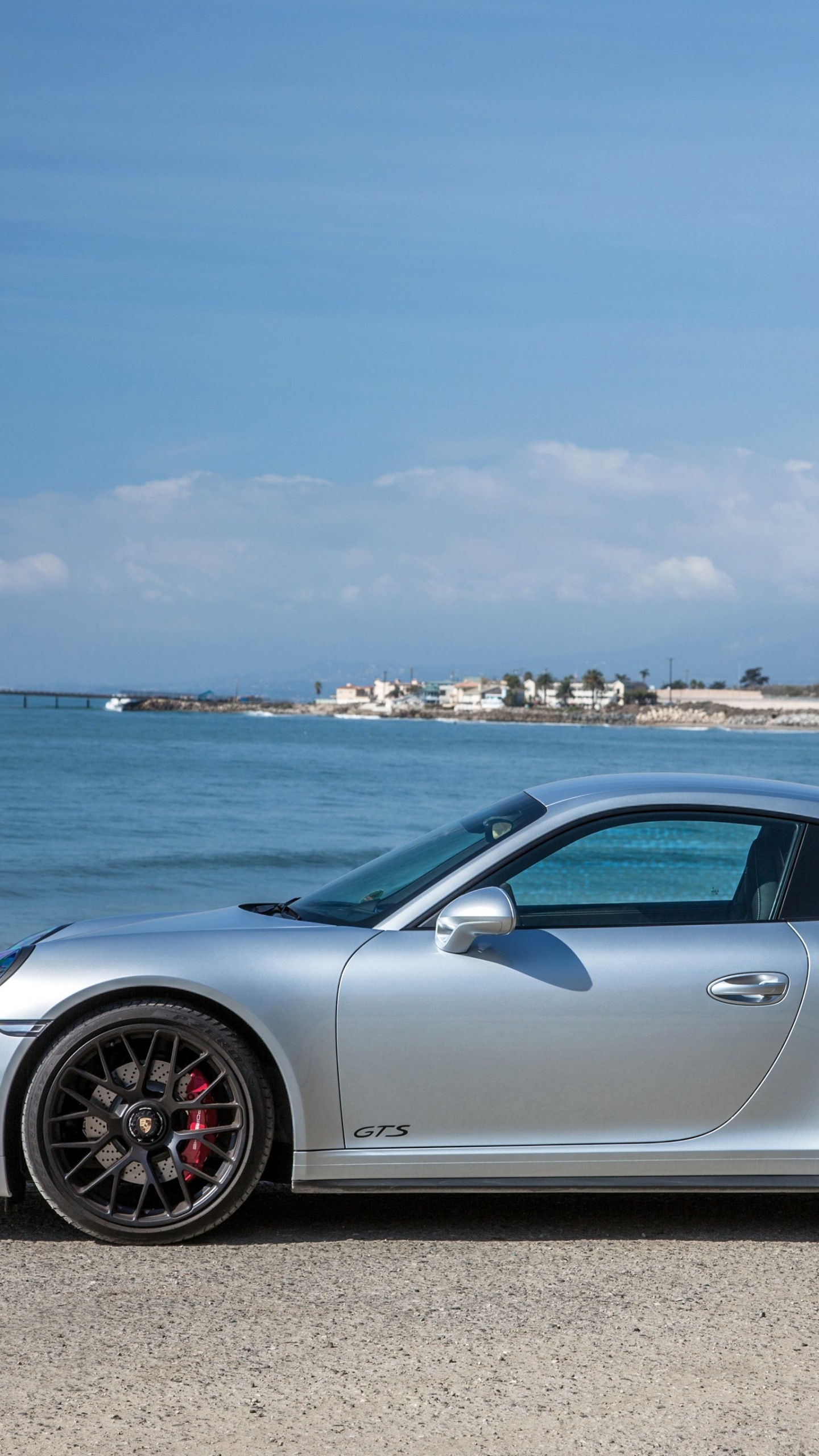 Silver Porsche 911 Parked on Seashore During Daytime. Wallpaper in 1440x2560 Resolution