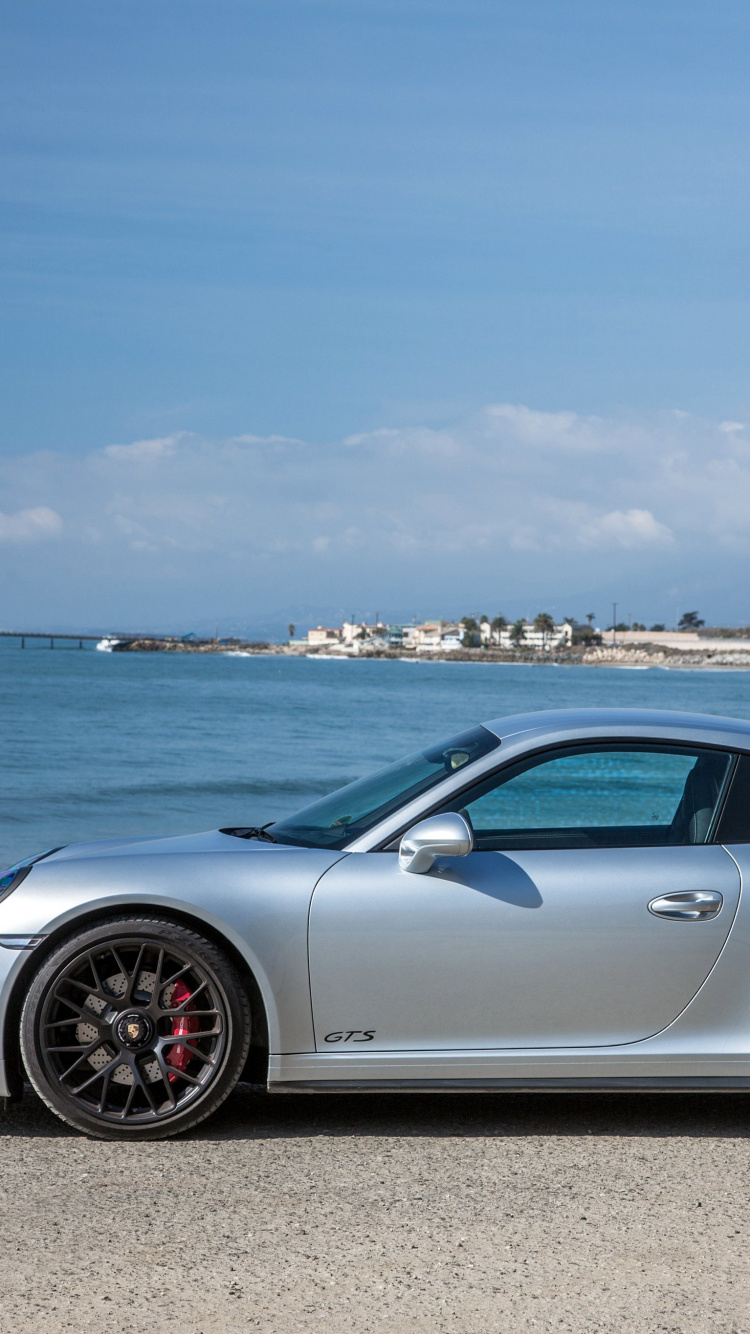 Silver Porsche 911 Parked on Seashore During Daytime. Wallpaper in 750x1334 Resolution