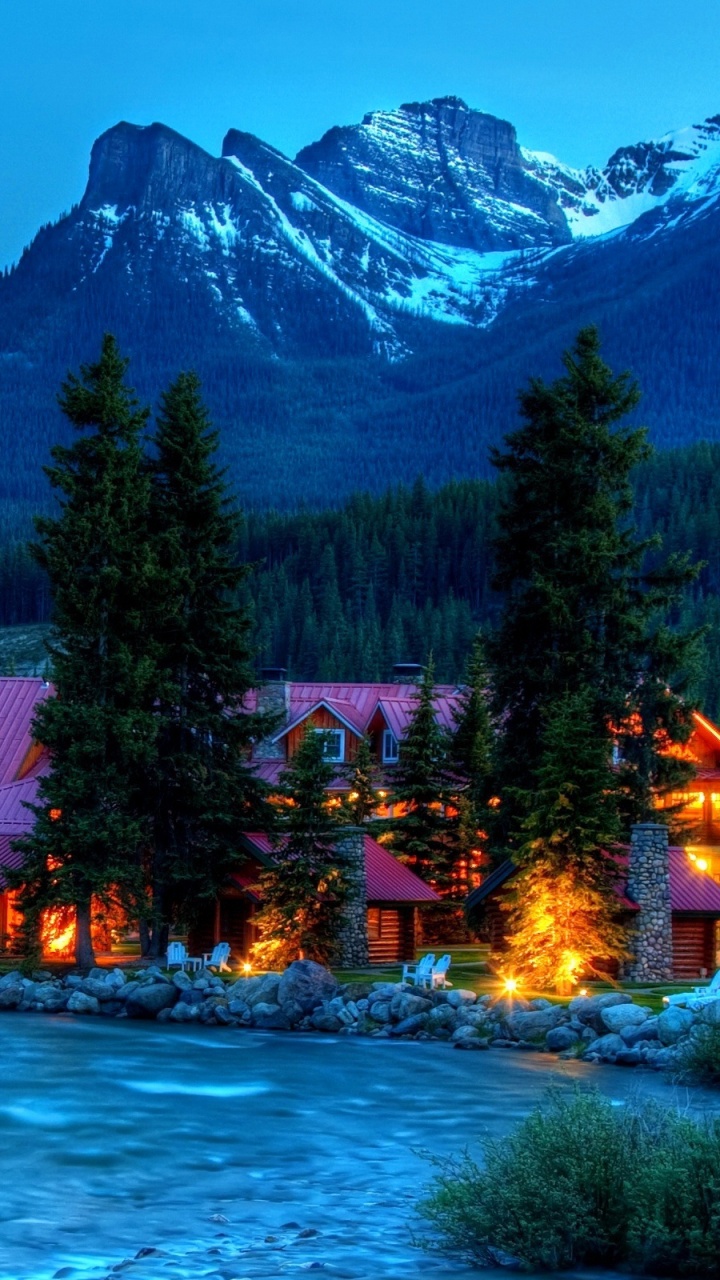 Brown House Near Green Trees and Lake During Daytime. Wallpaper in 720x1280 Resolution