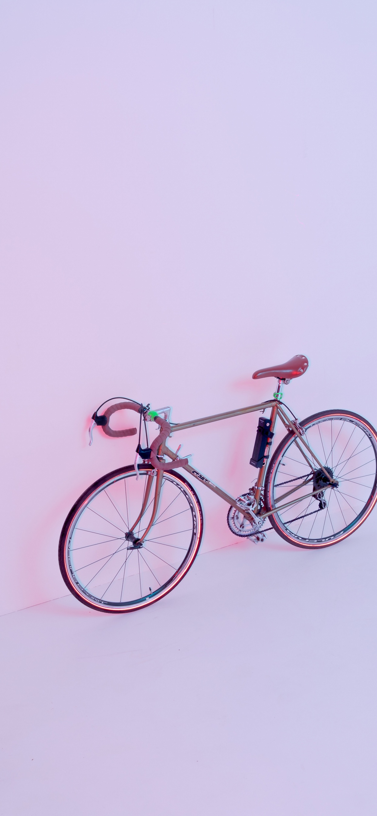 Brown City Bike on White Wall. Wallpaper in 1242x2688 Resolution