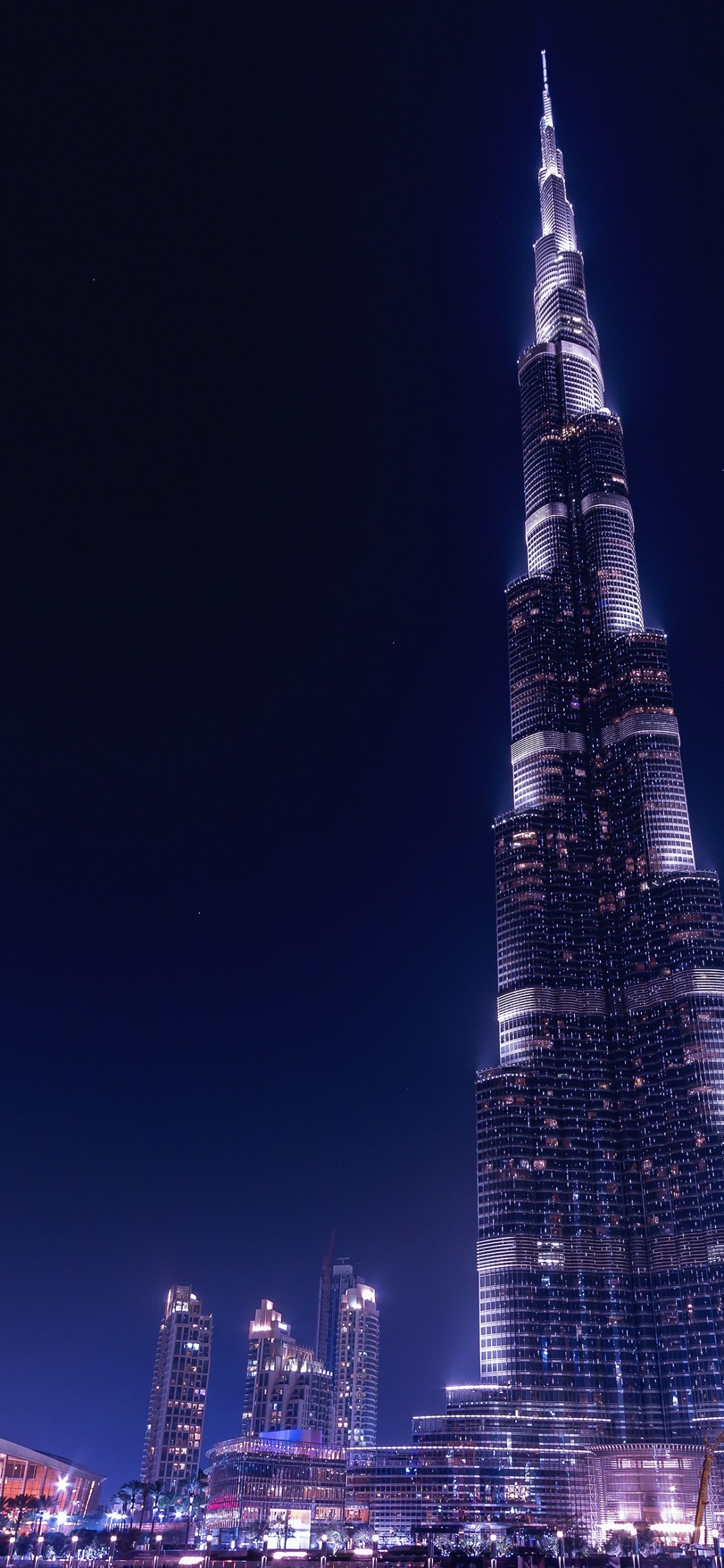 City Skyline During Night Time. Wallpaper in 1125x2436 Resolution