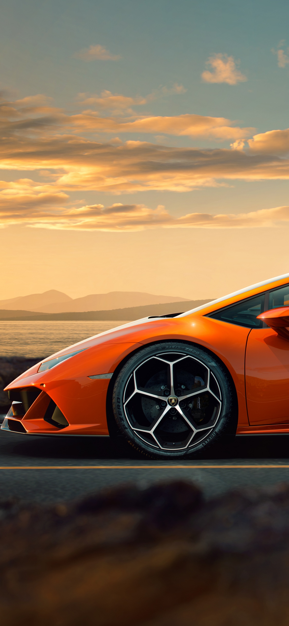 Orange Porsche 911 on Road During Daytime. Wallpaper in 1125x2436 Resolution