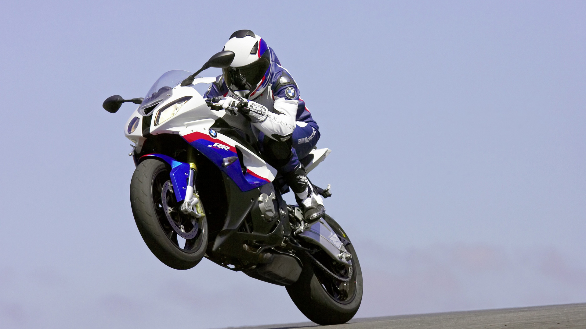 Man in White and Black Motorcycle Helmet Riding White and Black Sports Bike. Wallpaper in 1920x1080 Resolution