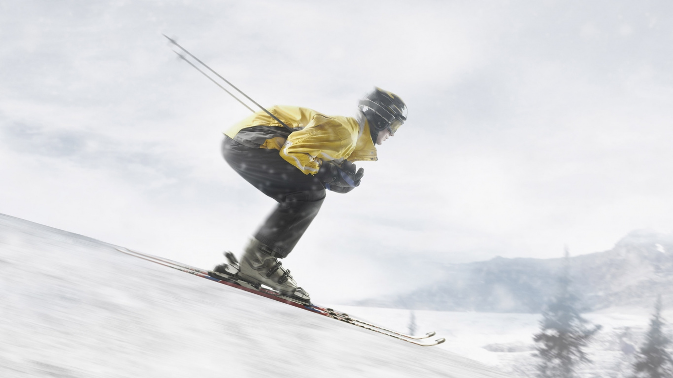 Mann in Gelber Jacke Und Blauer Denim-Jeans Reitet Skischaufeln Auf Schneebedecktem Boden Während. Wallpaper in 1366x768 Resolution