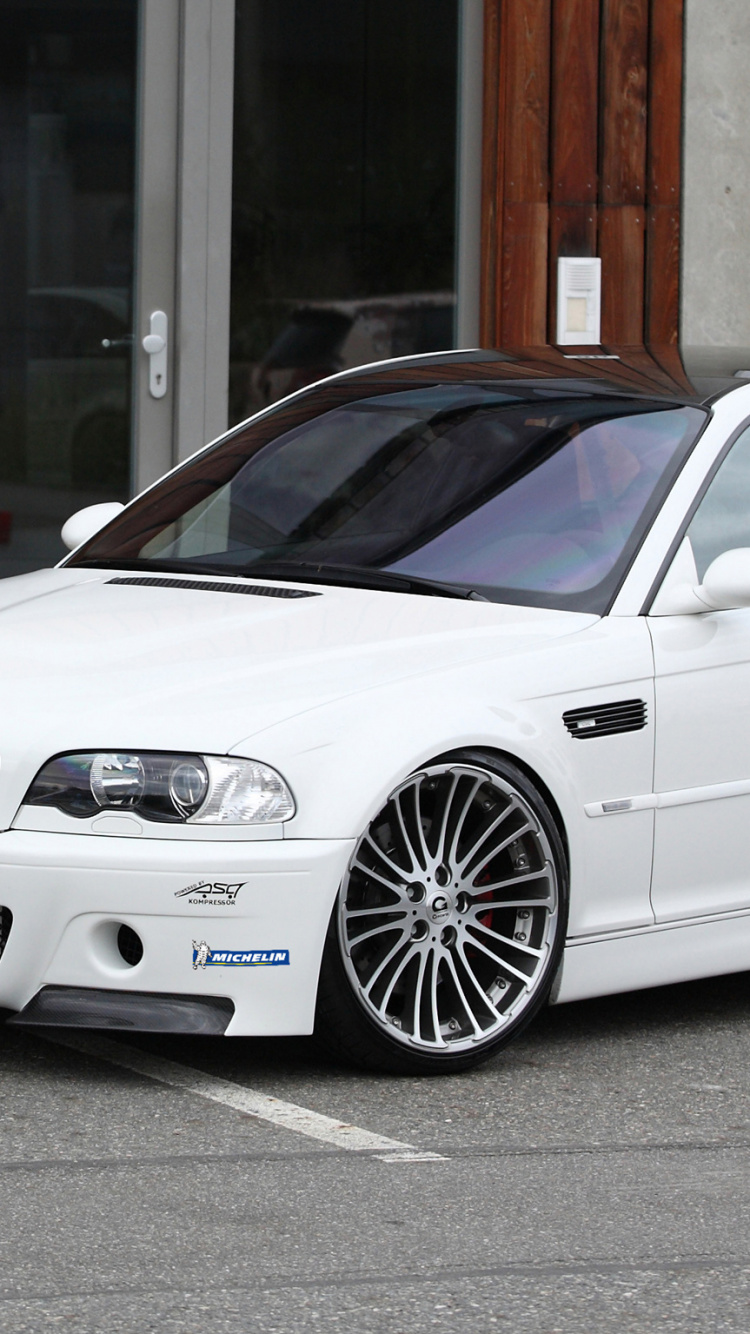 White Bmw m 3 Coupe Parked Near Brown Wooden Door. Wallpaper in 750x1334 Resolution