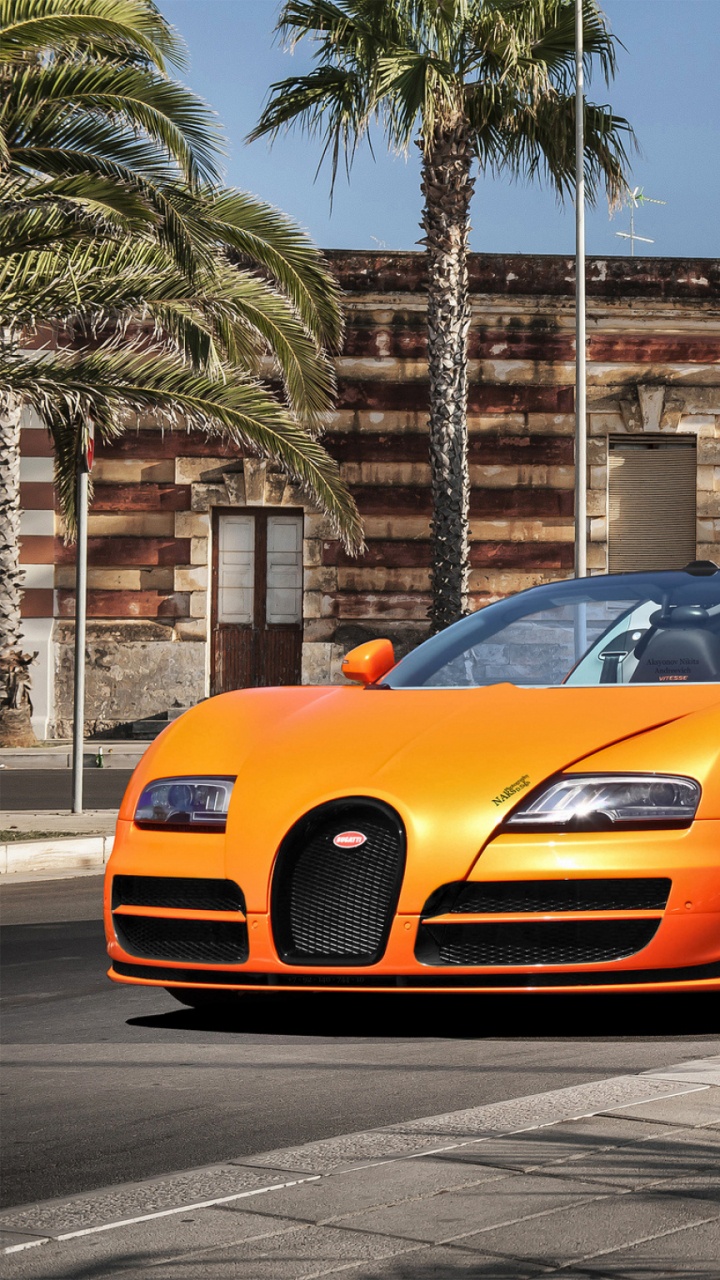 Orangefarbener Lamborghini Aventador, Der Tagsüber Auf Der Straße Geparkt Ist. Wallpaper in 720x1280 Resolution