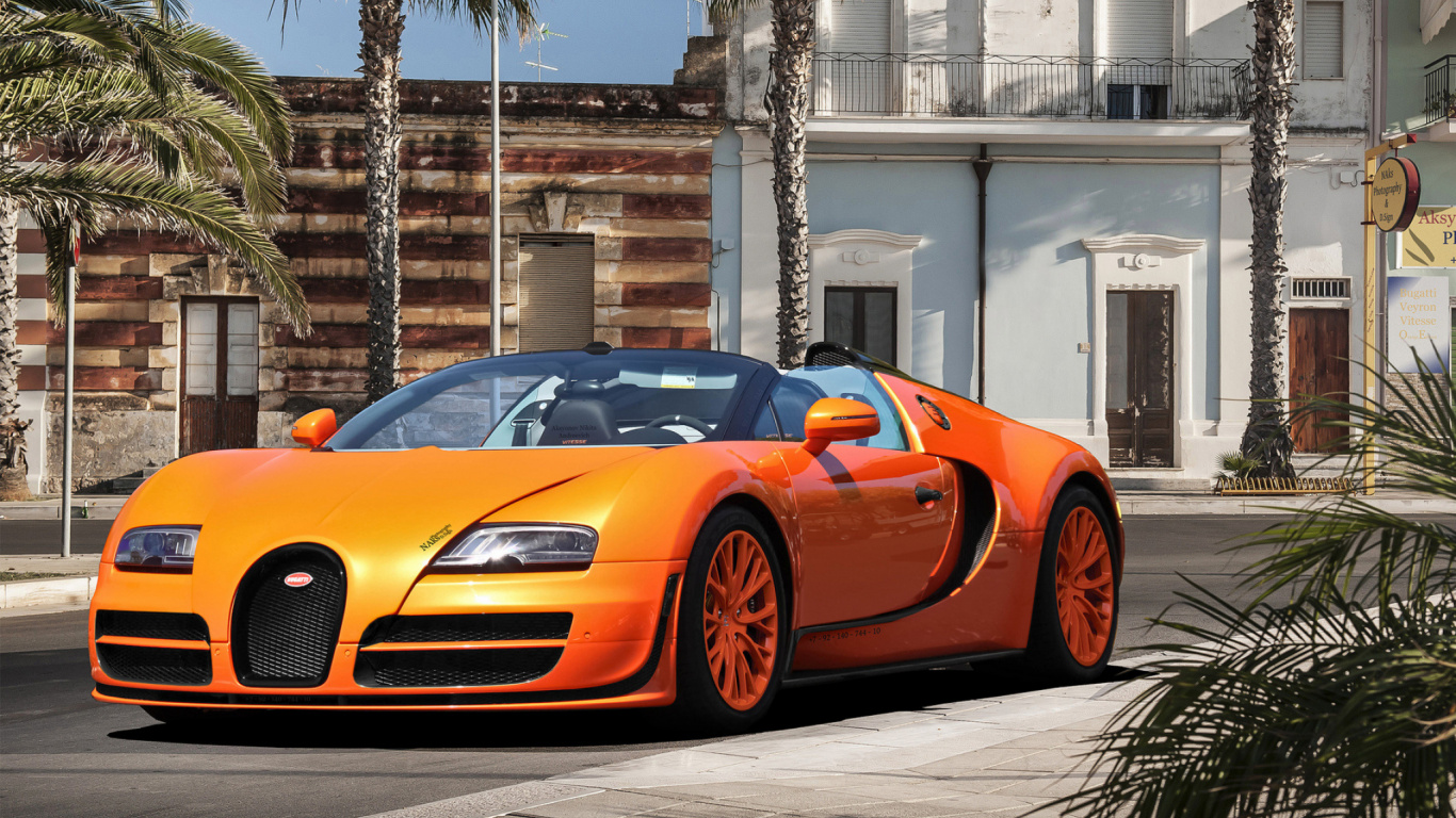 Lamborghini Aventador Orange Garée Dans la Rue Pendant la Journée. Wallpaper in 1366x768 Resolution