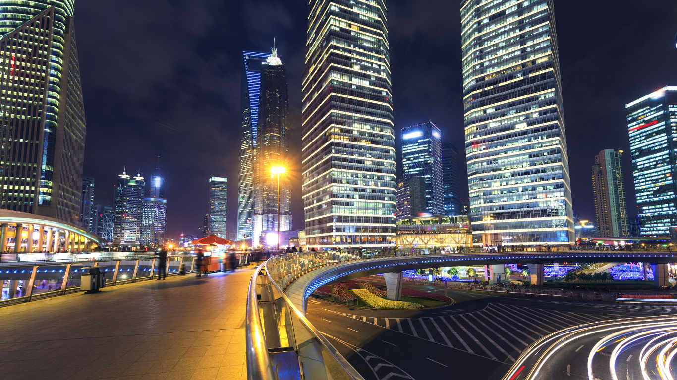 Cars on Road Near High Rise Buildings During Night Time. Wallpaper in 1366x768 Resolution
