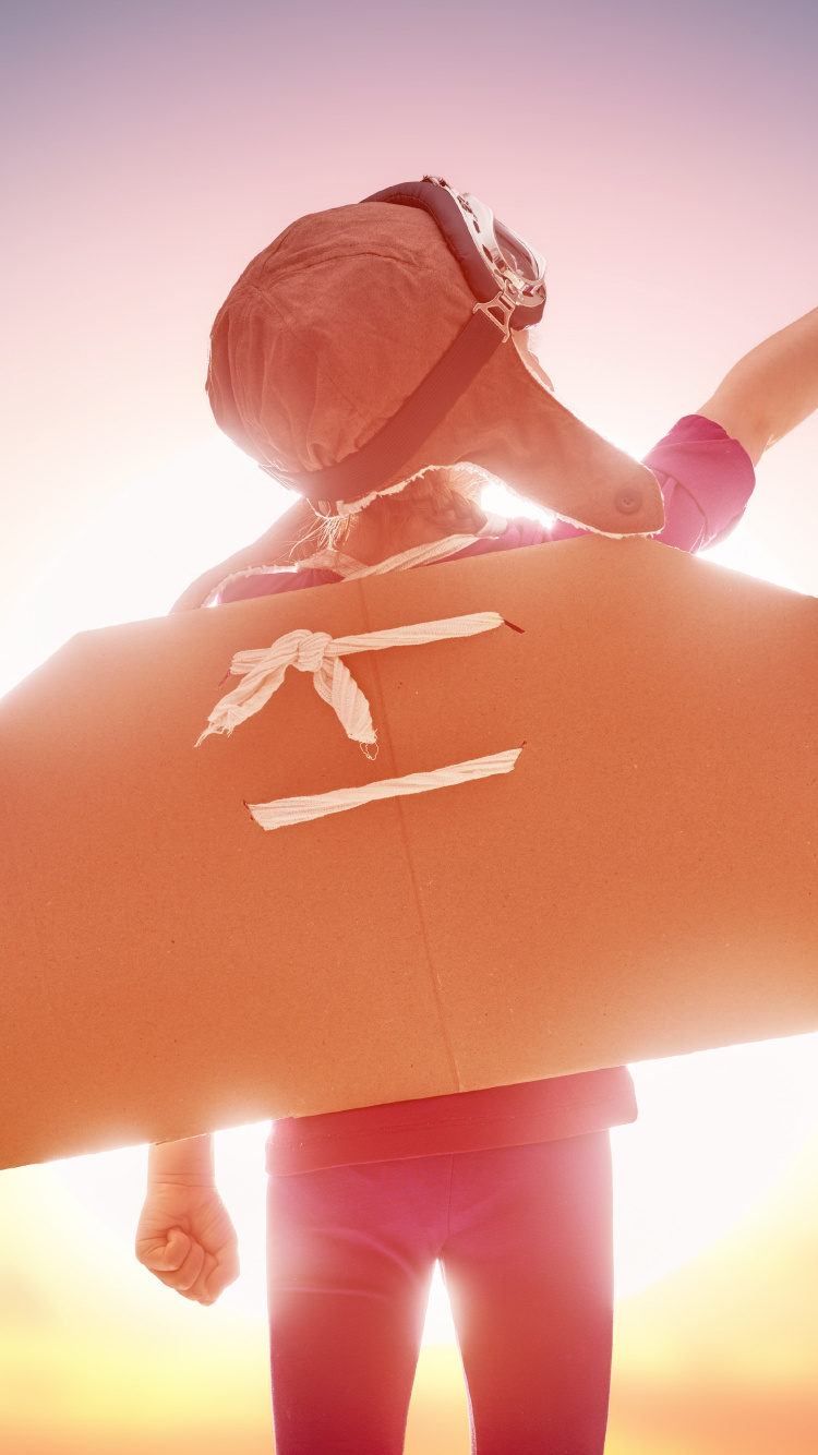 Woman in Orange Dress Holding White Cross. Wallpaper in 750x1334 Resolution