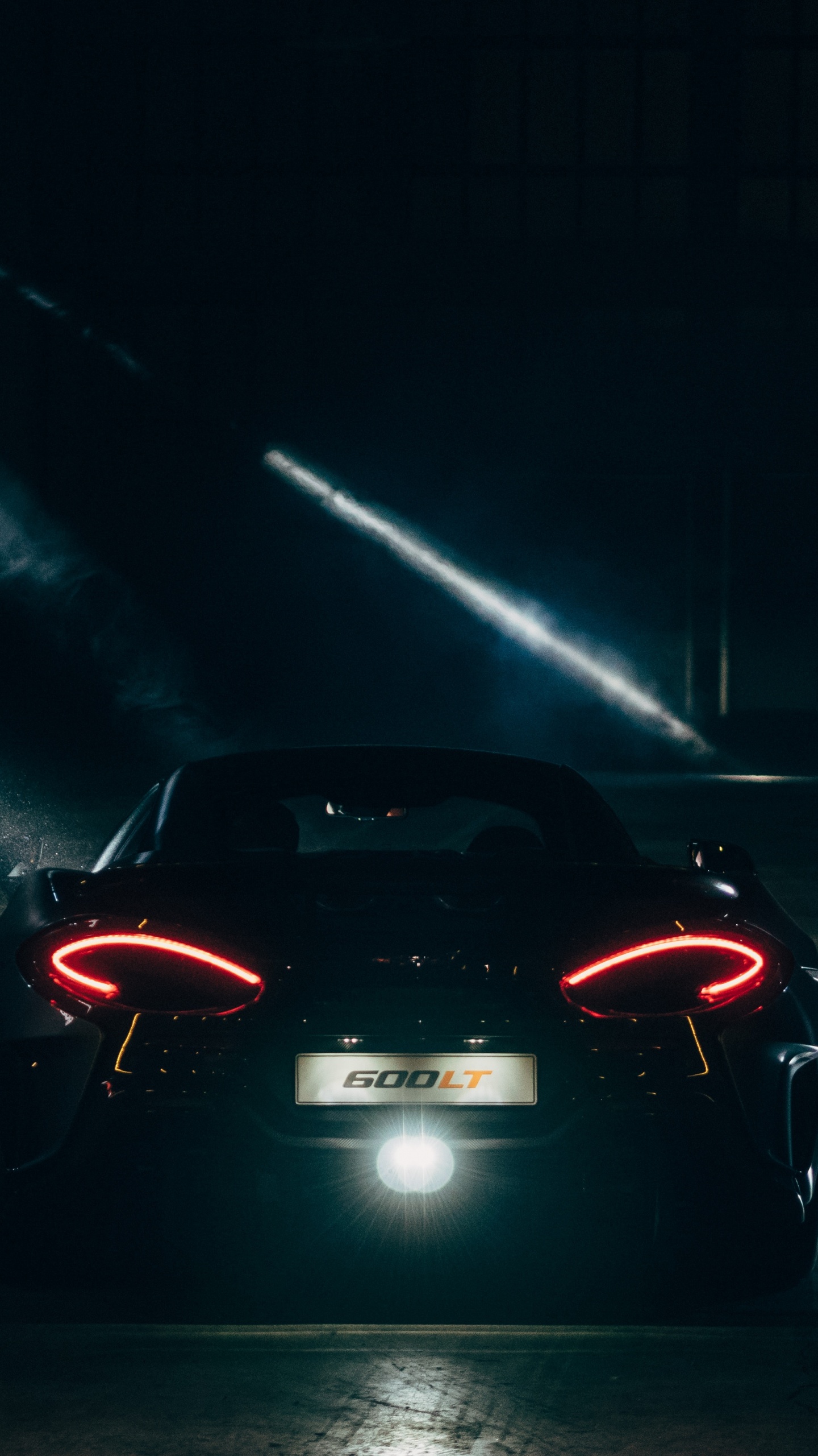 Red Ferrari Sports Car on Road During Nighttime. Wallpaper in 1440x2560 Resolution