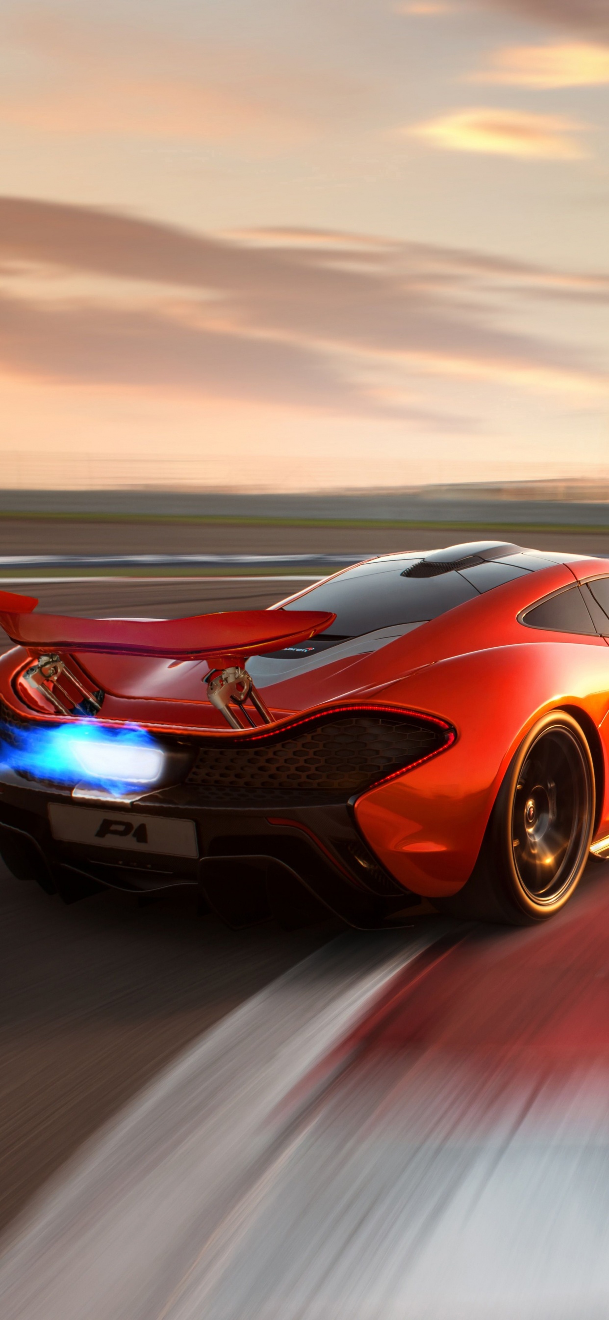 Porsche 911 Naranja y Negro en la Carretera Durante el Día. Wallpaper in 1242x2688 Resolution