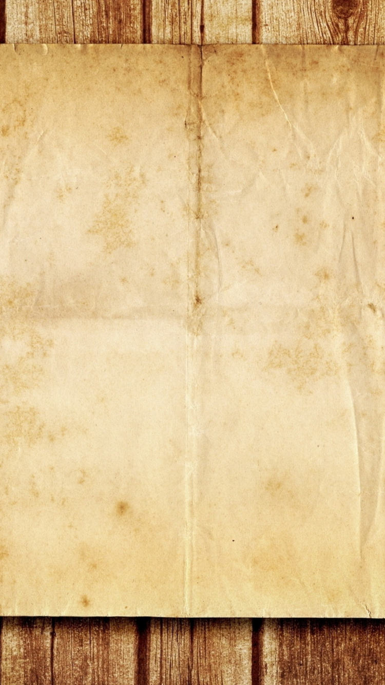 Papier Blanc Sur Une Surface en Bois Marron. Wallpaper in 750x1334 Resolution