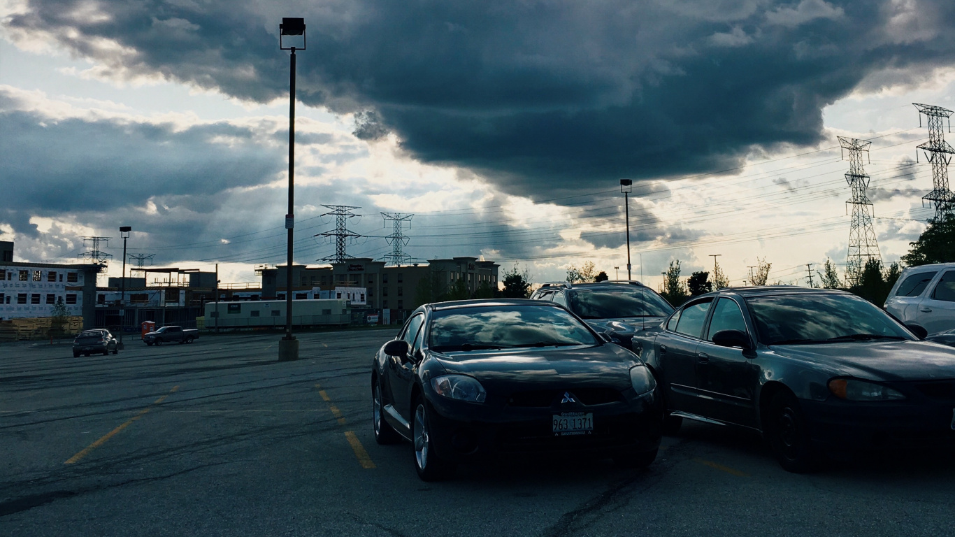 Cars on Road Under Cloudy Sky During Daytime. Wallpaper in 1366x768 Resolution