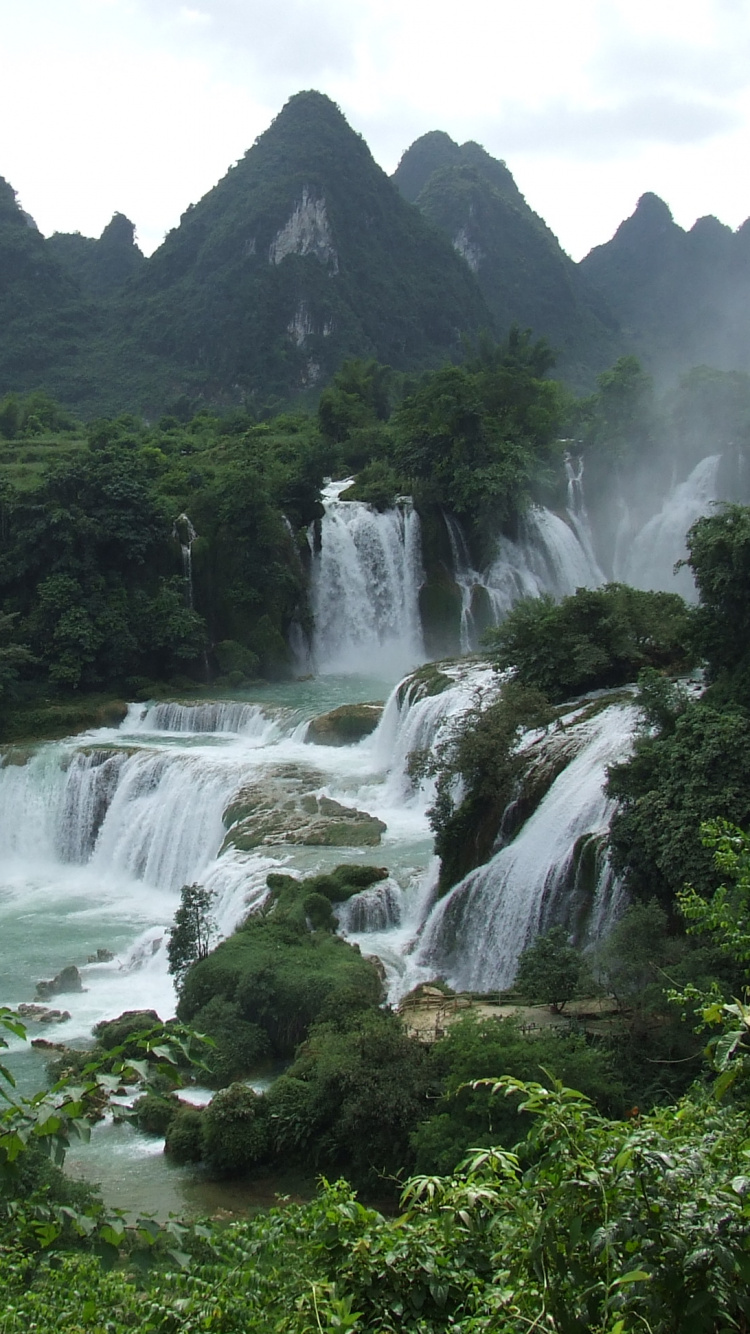 Waterfalls Near Green Trees and Mountain During Daytime. Wallpaper in 750x1334 Resolution