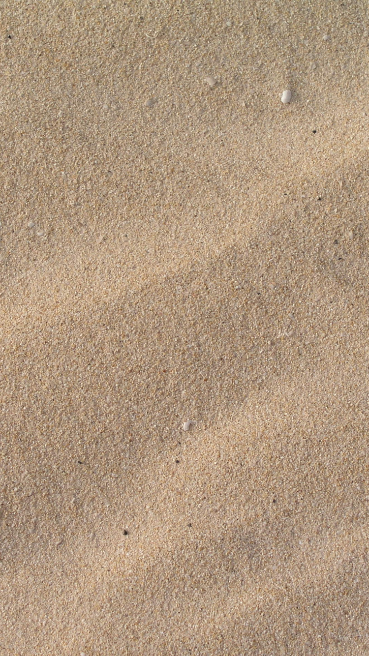Brauner Sand Mit Schatten Der Person. Wallpaper in 750x1334 Resolution