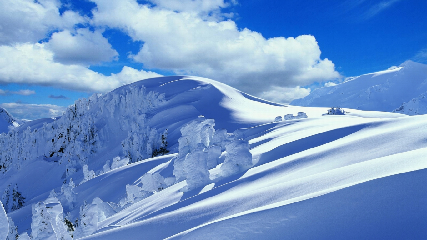 Snow Covered Mountain Under White Clouds and Blue Sky During Daytime. Wallpaper in 1366x768 Resolution
