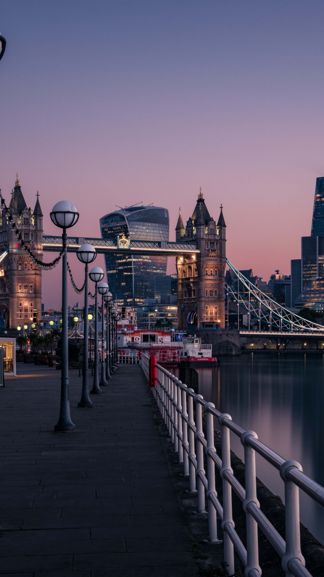 Bridge Over River Near City Buildings During Daytime. Wallpaper in 1080x1920 Resolution