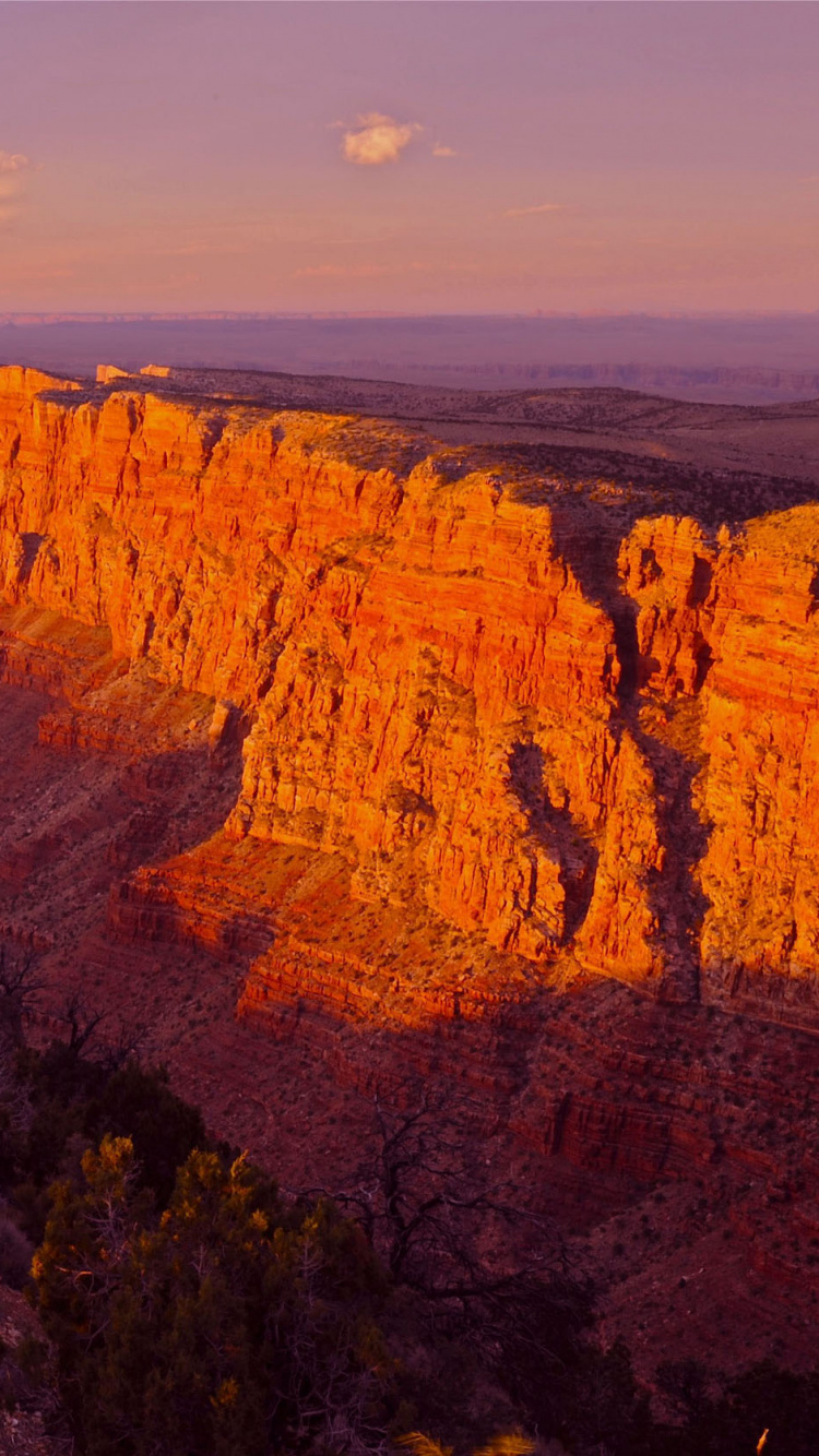 Brown Rocky Mountain Under Blue Sky During Daytime. Wallpaper in 750x1334 Resolution