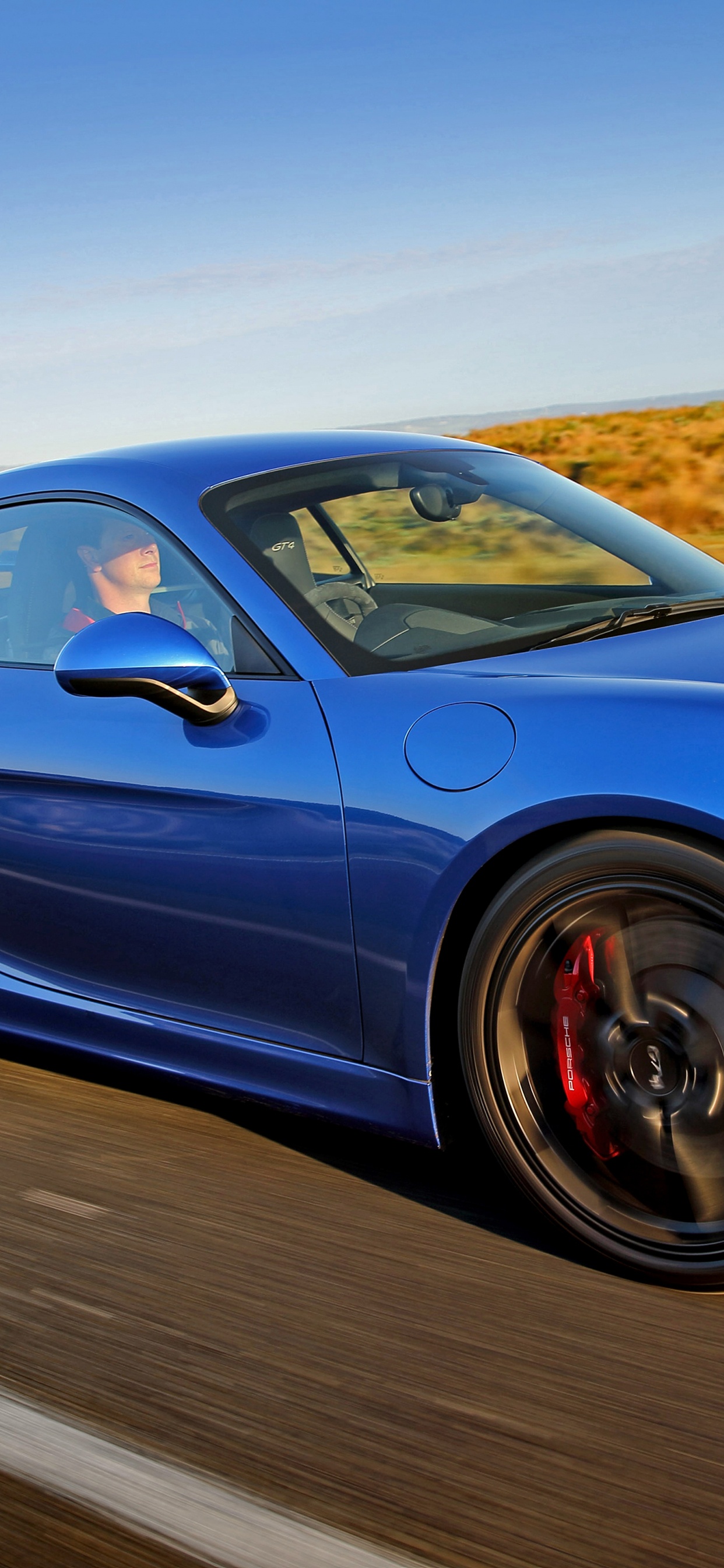 Blue Porsche 911 on Road During Daytime. Wallpaper in 1242x2688 Resolution