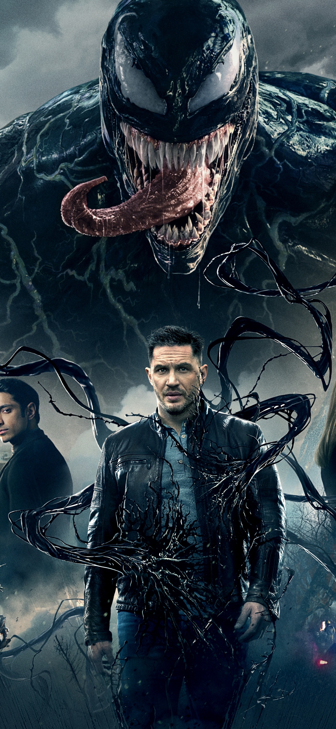 Man and Woman Standing Beside Man in Black Leather Jacket. Wallpaper in 1125x2436 Resolution