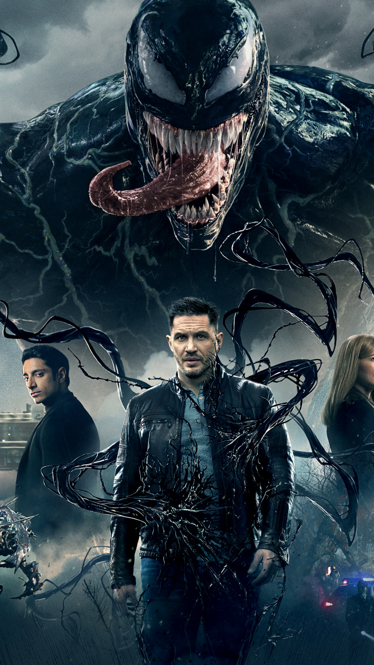 L'homme et la Femme Debout à Côté de L'homme en Blouson de Cuir Noir. Wallpaper in 750x1334 Resolution