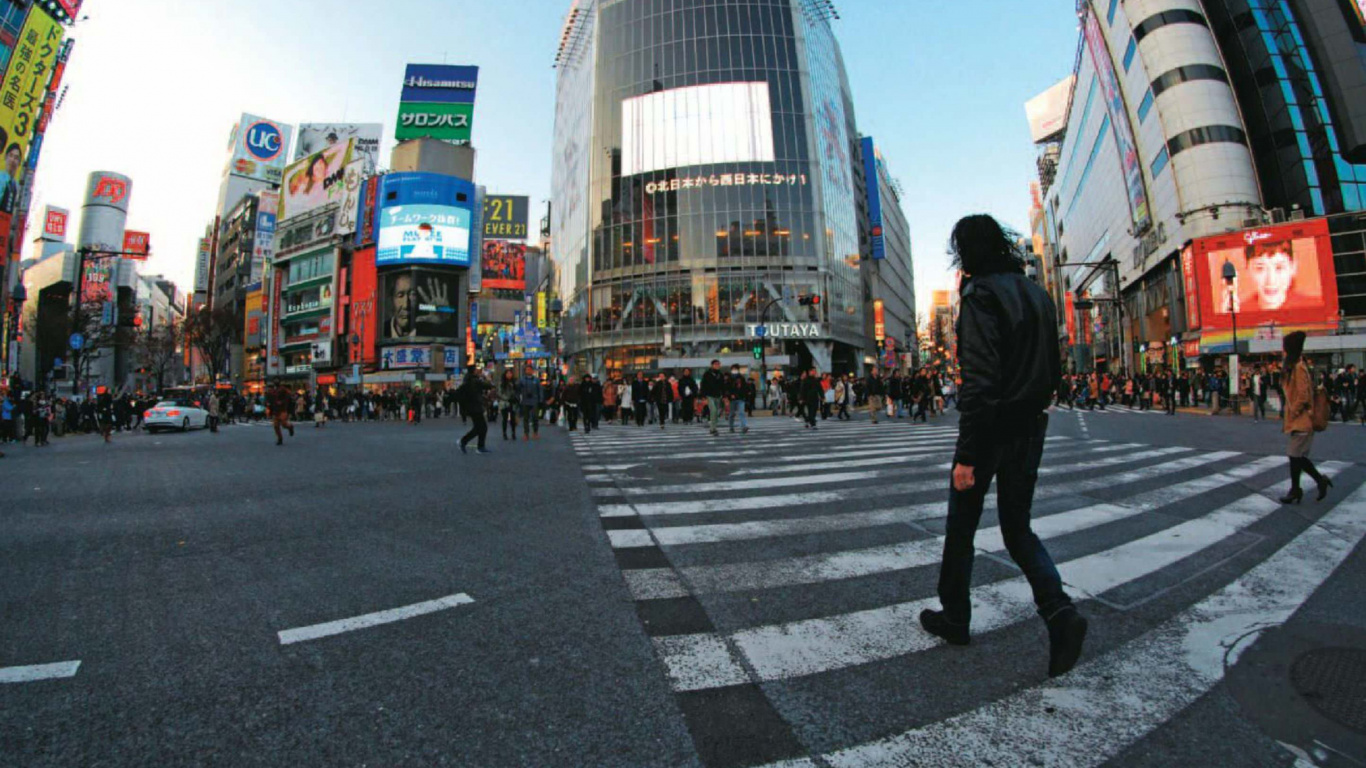 Man in Black Jacket Walking on Pedestrian Lane During Daytime. Wallpaper in 1366x768 Resolution