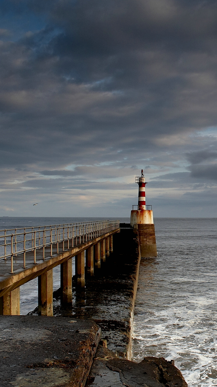Brown Wooden Dock on Sea Under Gray Clouds During Daytime. Wallpaper in 750x1334 Resolution