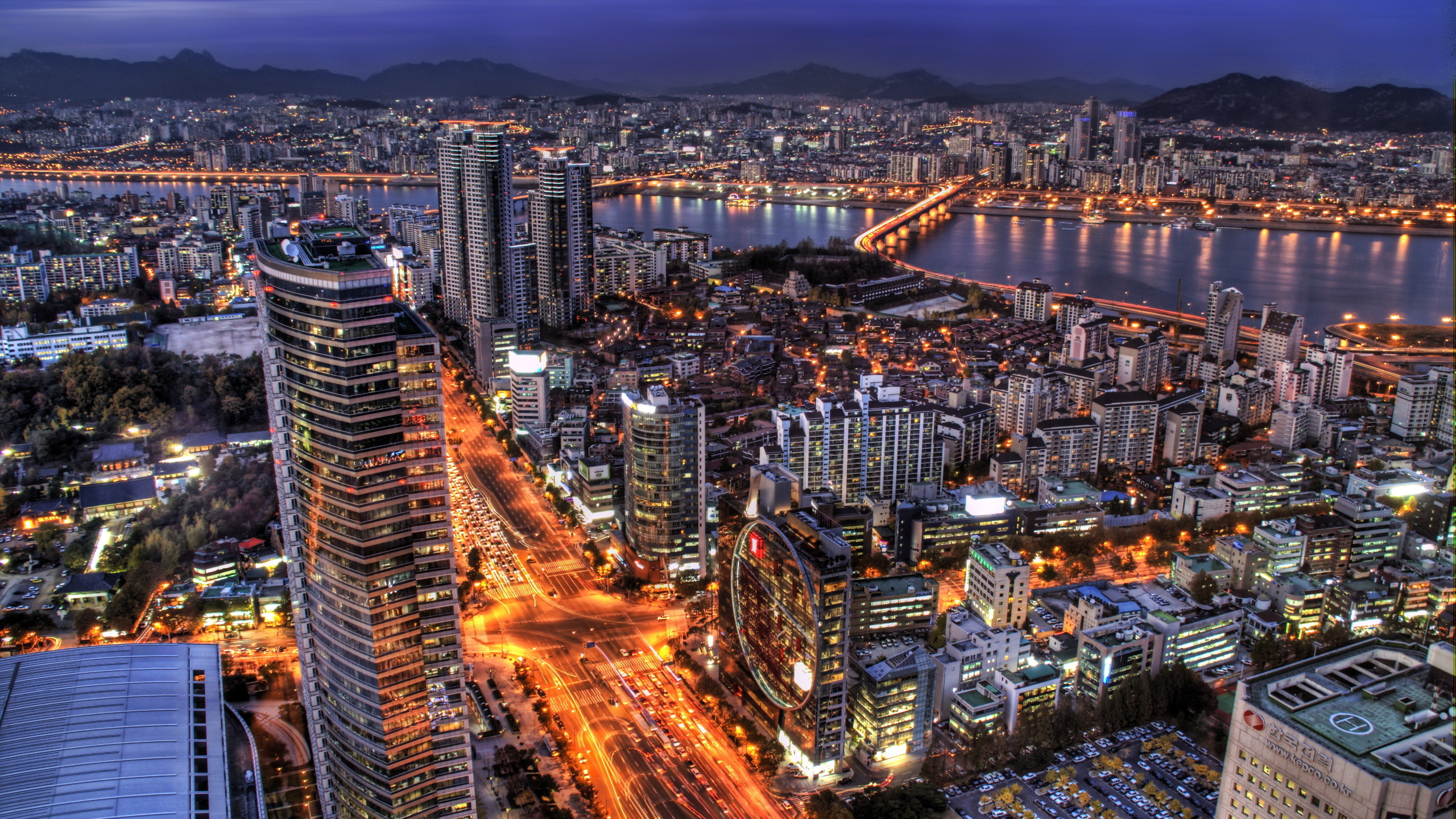 Aerial View of City Buildings During Night Time. Wallpaper in 2560x1440 Resolution