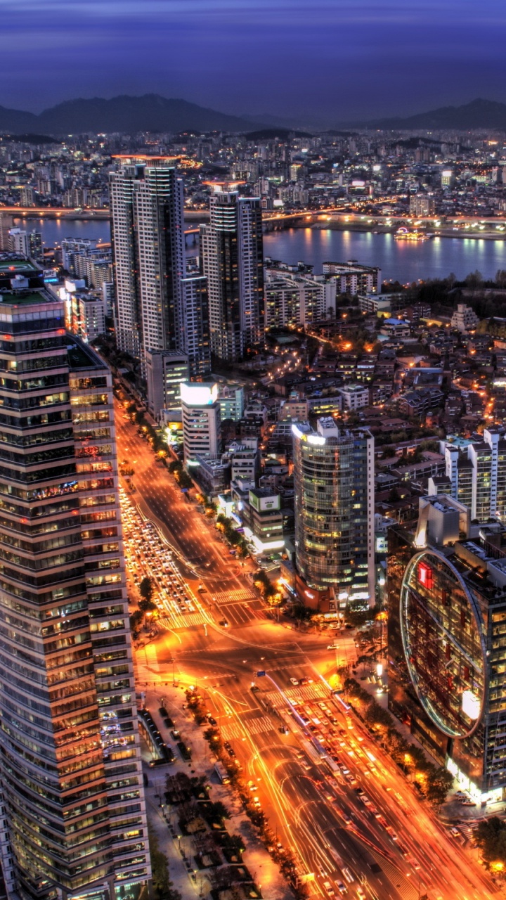 Vue Aérienne Des Bâtiments de la Ville Pendant la Nuit. Wallpaper in 720x1280 Resolution