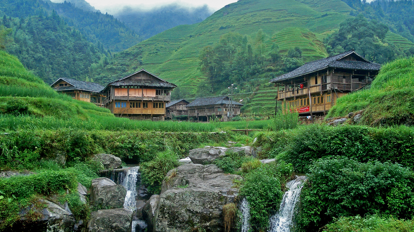 Brown Wooden House Near Water Falls During Daytime. Wallpaper in 1366x768 Resolution