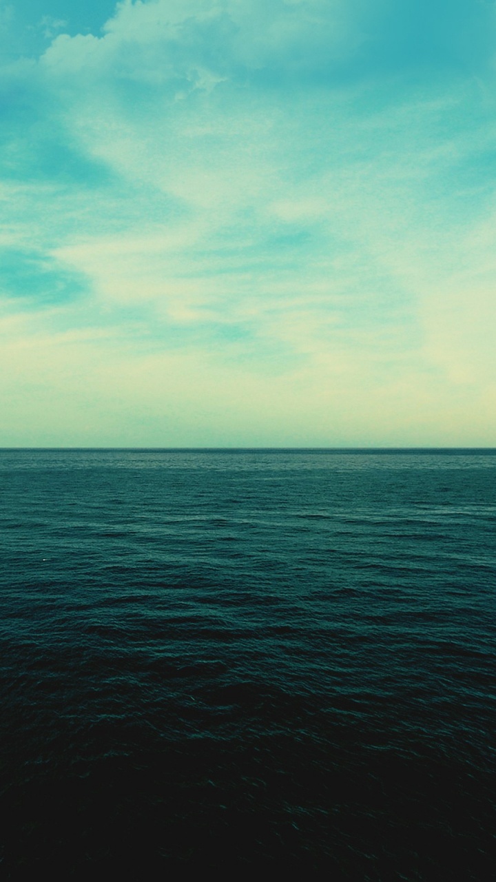 Blue Ocean Under Blue Sky During Daytime. Wallpaper in 720x1280 Resolution