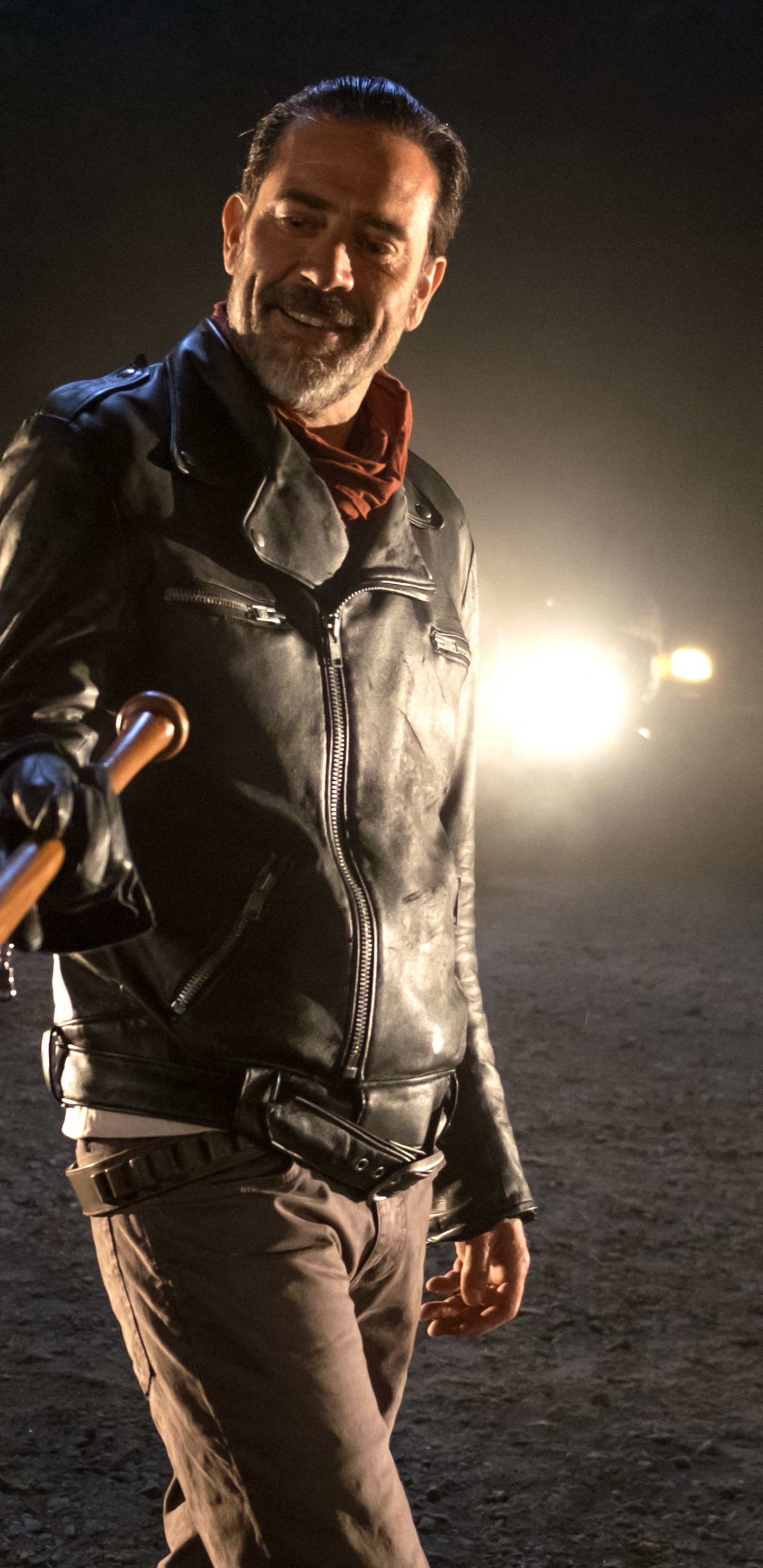 Man in Black Leather Jacket Holding Black and Blue Walking Stick. Wallpaper in 1440x2960 Resolution