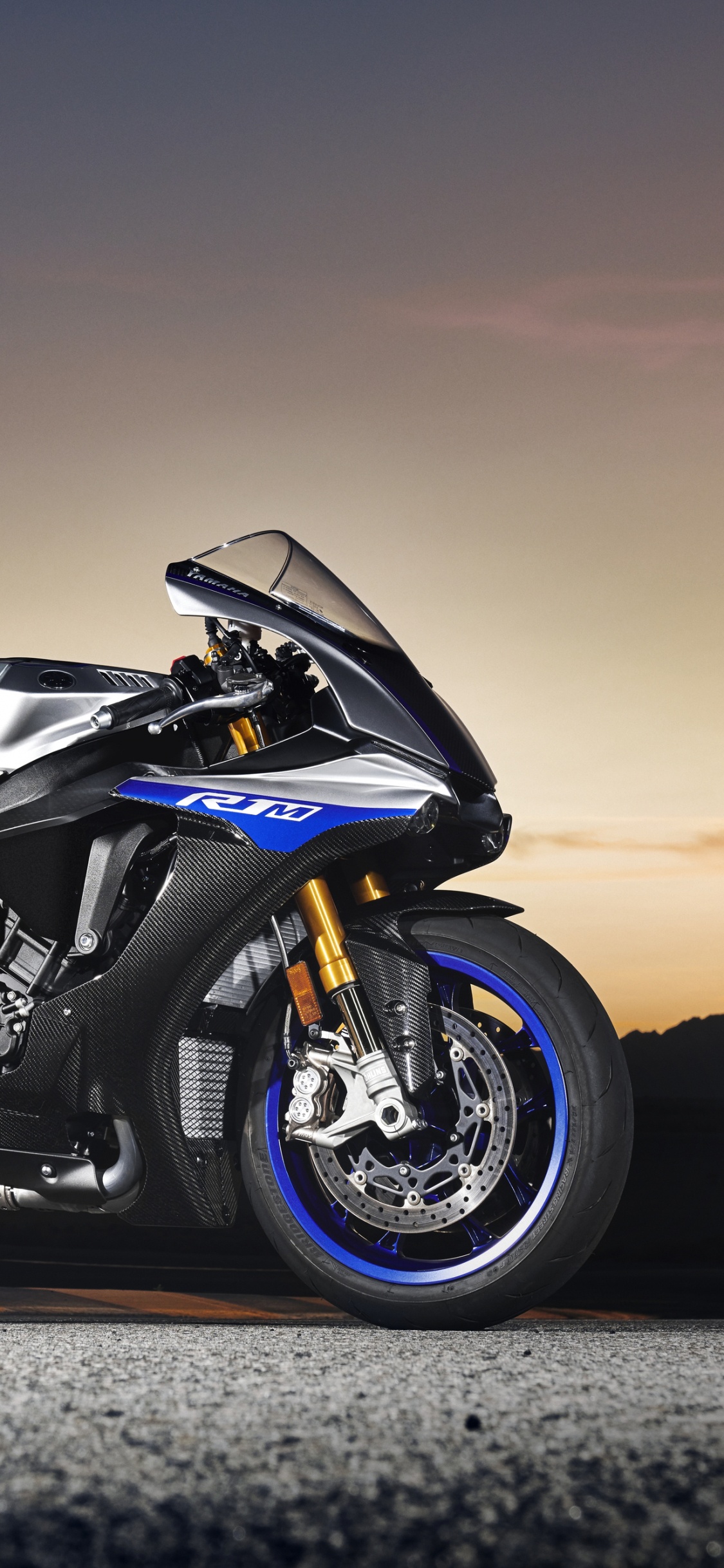 Black Sports Bike on Gray Asphalt Road During Daytime. Wallpaper in 1125x2436 Resolution