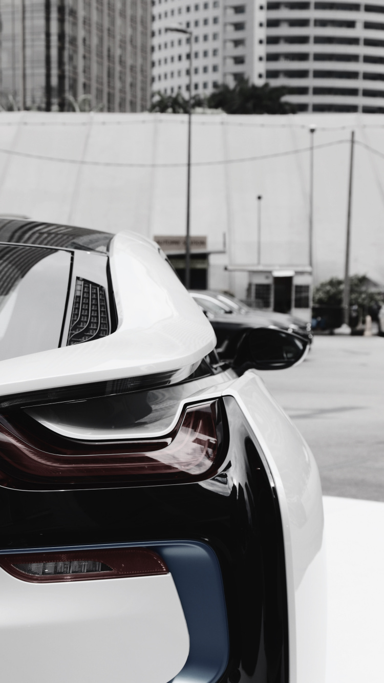 Black and Red Car on Road During Daytime. Wallpaper in 750x1334 Resolution