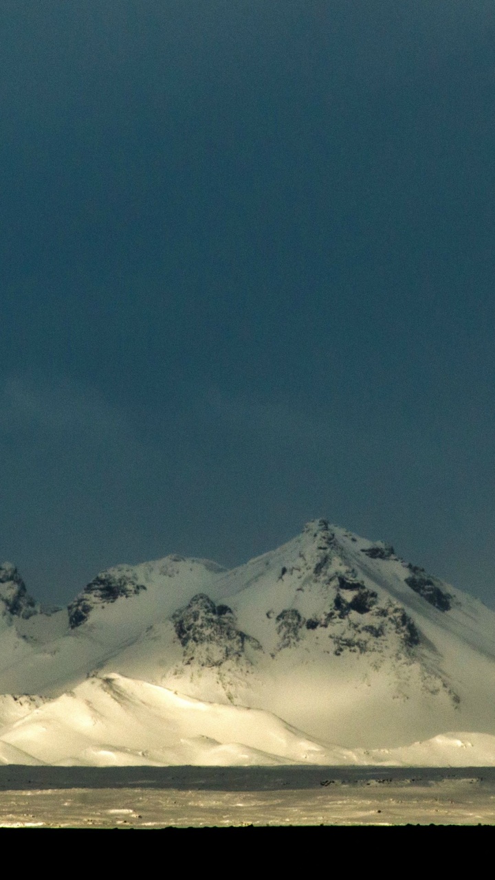 Snow Covered Mountain Under Blue Sky During Daytime. Wallpaper in 720x1280 Resolution