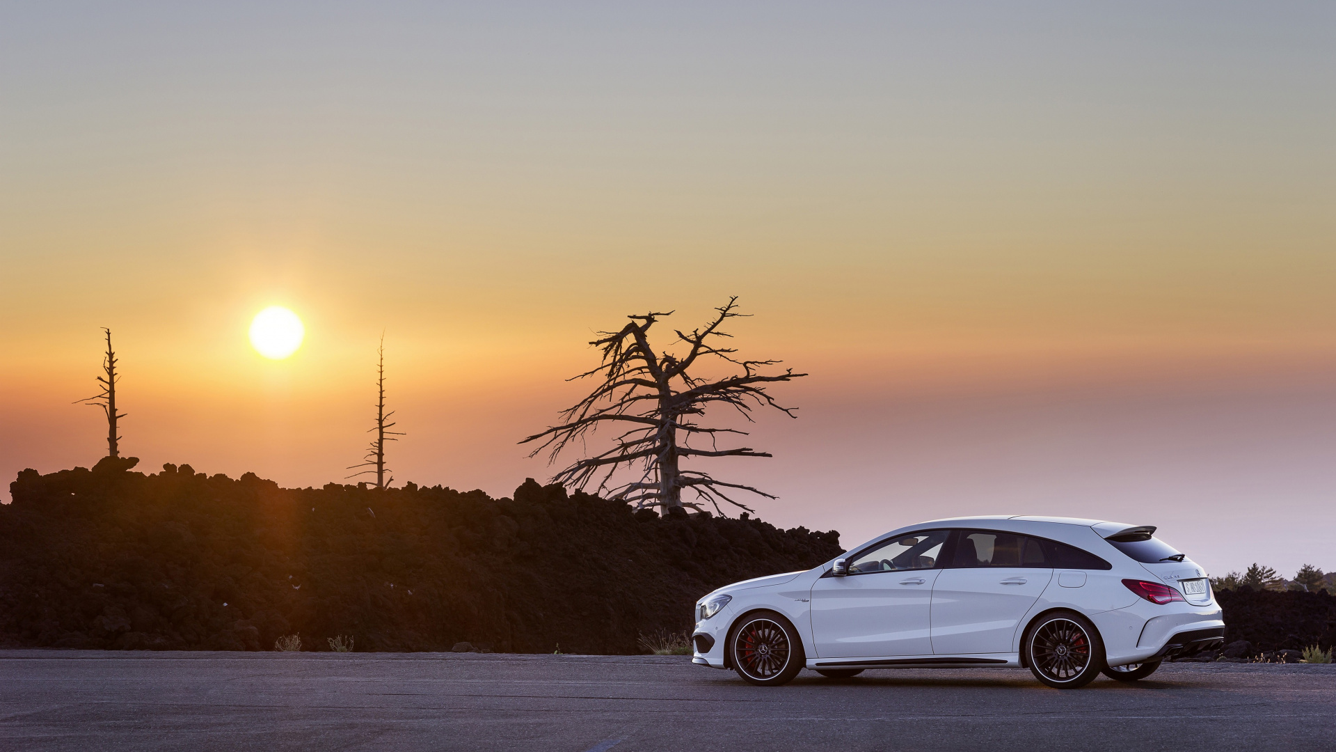White Sedan on Snow Covered Road During Sunset. Wallpaper in 1920x1080 Resolution