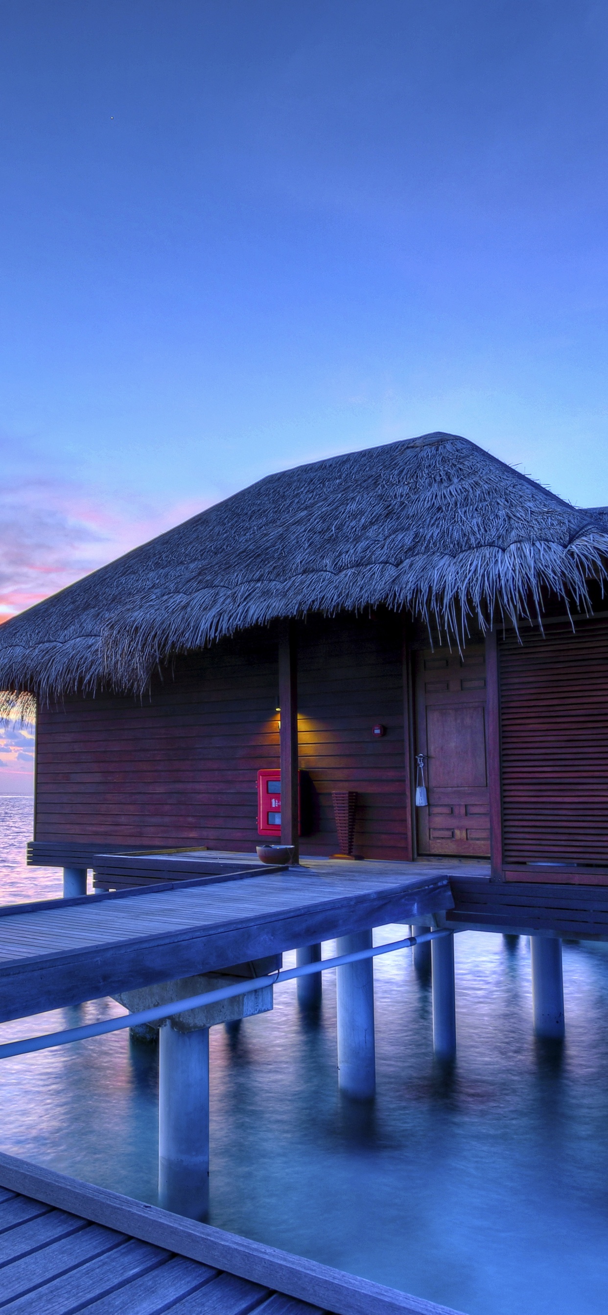 Brown Wooden House on Sea Dock During Daytime. Wallpaper in 1242x2688 Resolution