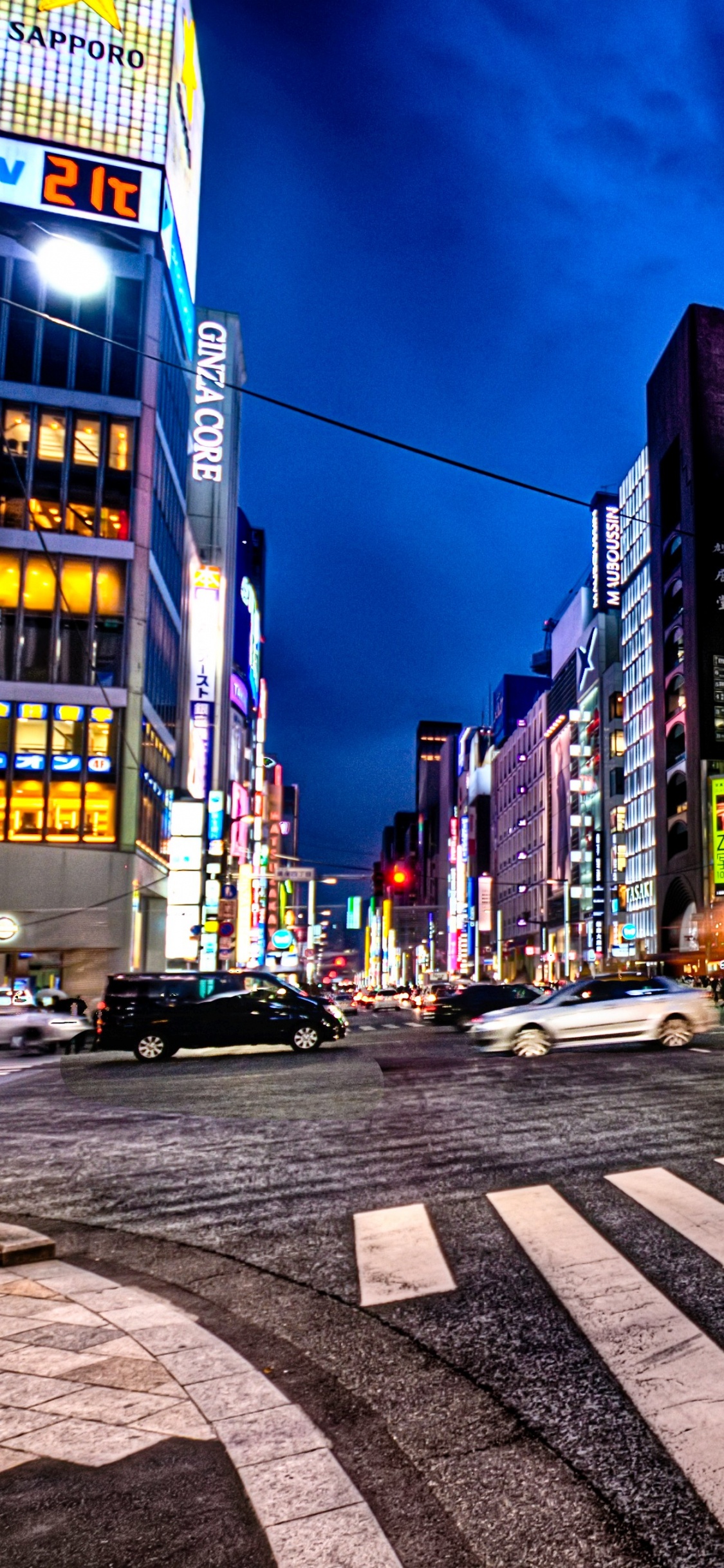 Cars on Road Near Buildings During Daytime. Wallpaper in 1125x2436 Resolution