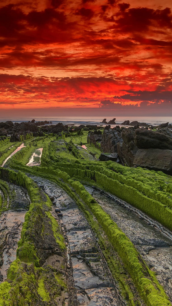 Green Mountain Under Orange Sky. Wallpaper in 720x1280 Resolution