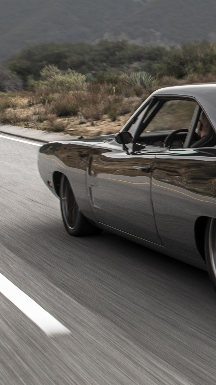 Black Coupe on Road During Daytime. Wallpaper in 750x1334 Resolution