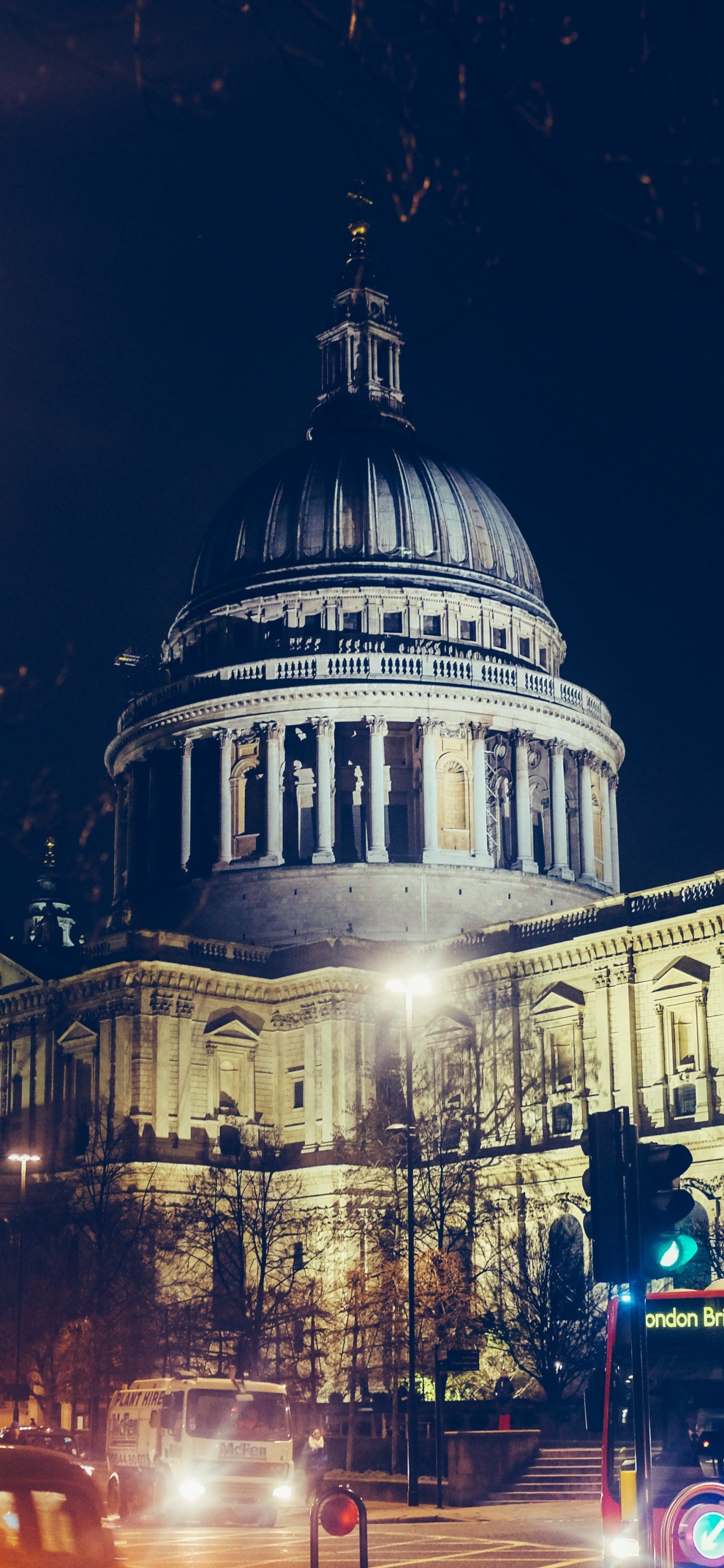 Cars on Road Near Building During Night Time. Wallpaper in 1242x2688 Resolution