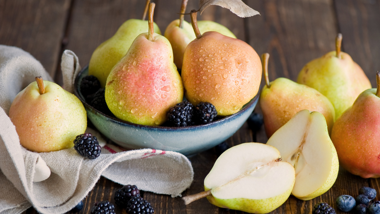 Sliced Apples and Oranges on White Ceramic Bowl. Wallpaper in 1280x720 Resolution