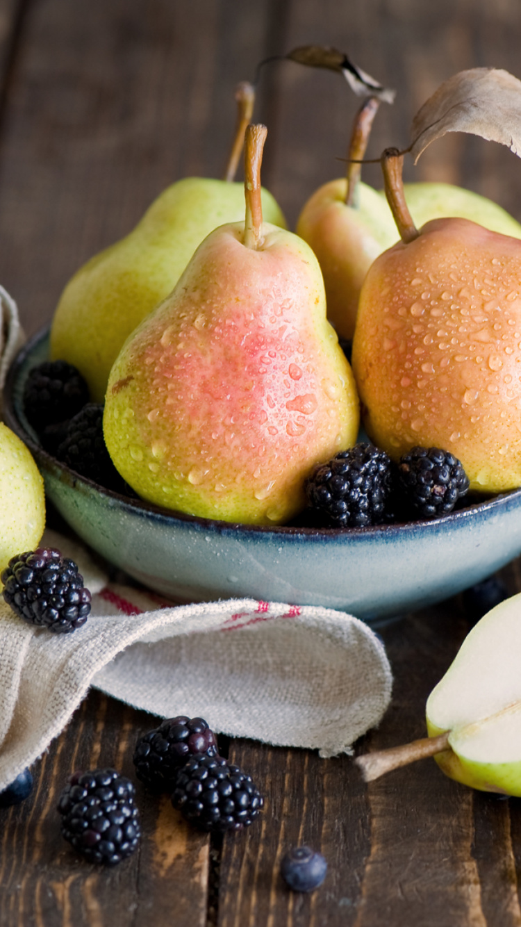 Sliced Apples and Oranges on White Ceramic Bowl. Wallpaper in 750x1334 Resolution